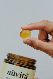 Bliss gummy held in hand