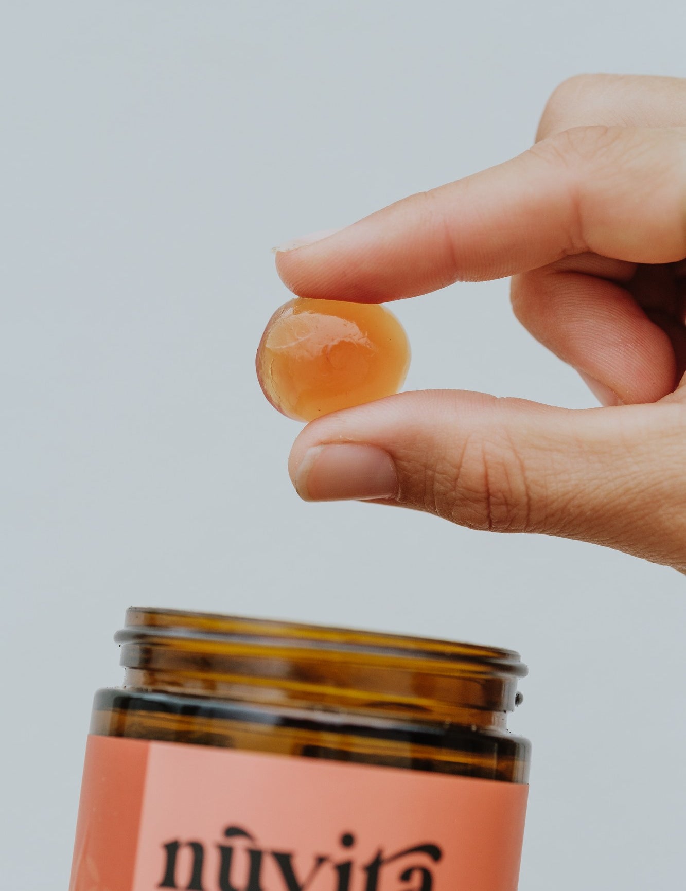 Chill gummy held in hand