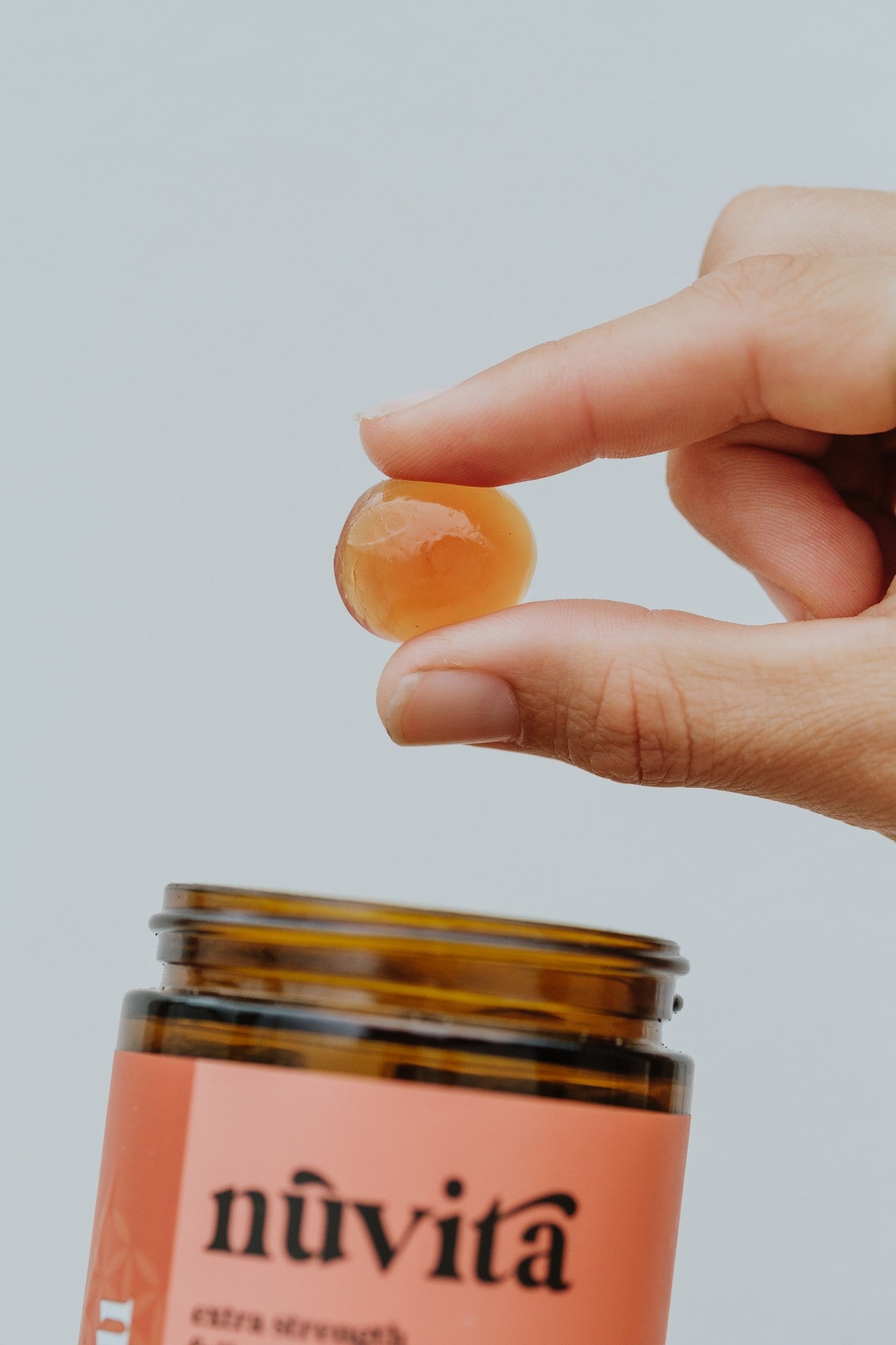 Chill gummy held in hand